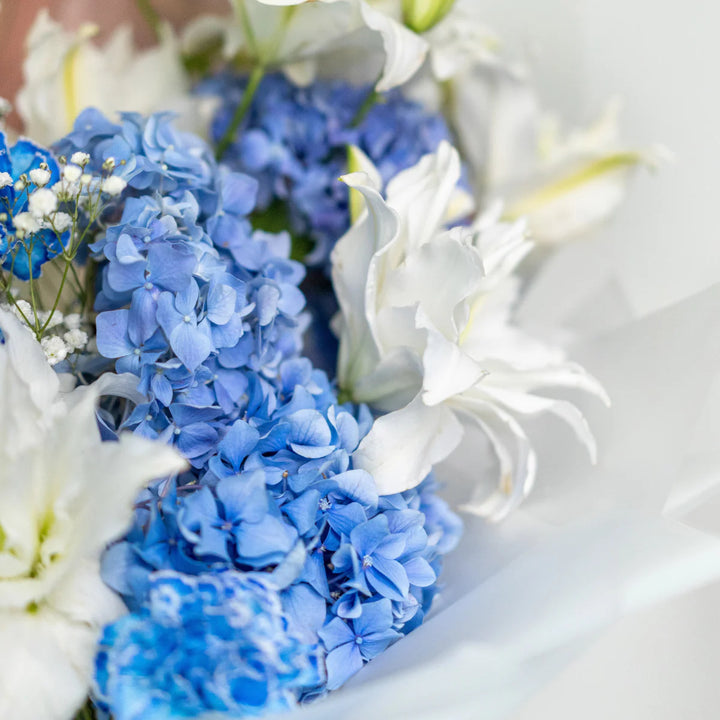 Bouquet "Emerald Enchantment" with lily and gypsophila