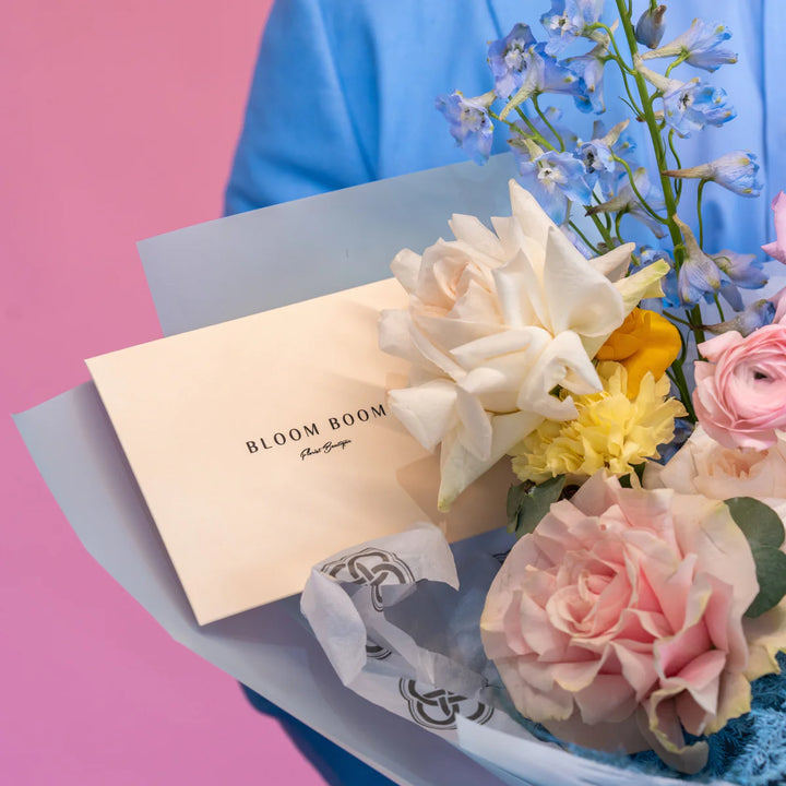 Simple bouquet "Rainbow" with roses and delphinium