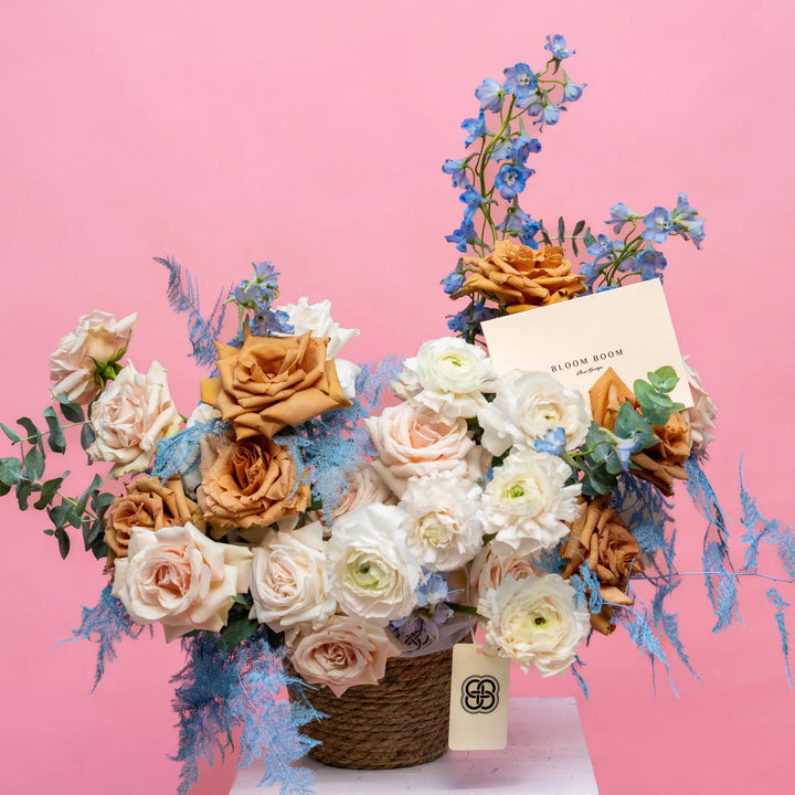 Flower basket "Cappuccino" with roses and ranunculus
